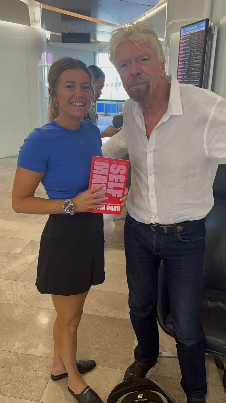 Olivia Carr holding a copy of Self-Made.